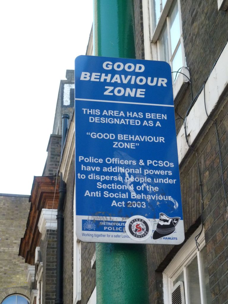 Street sign saying "Good behaviour zone".