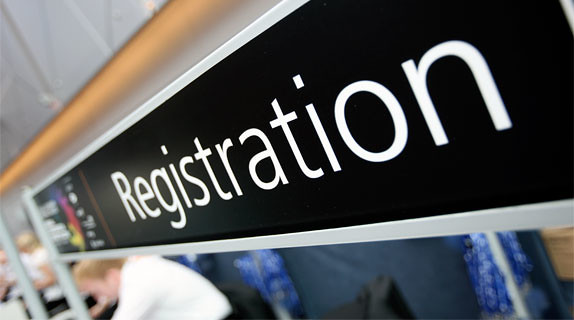 Photograph of registration desk banner